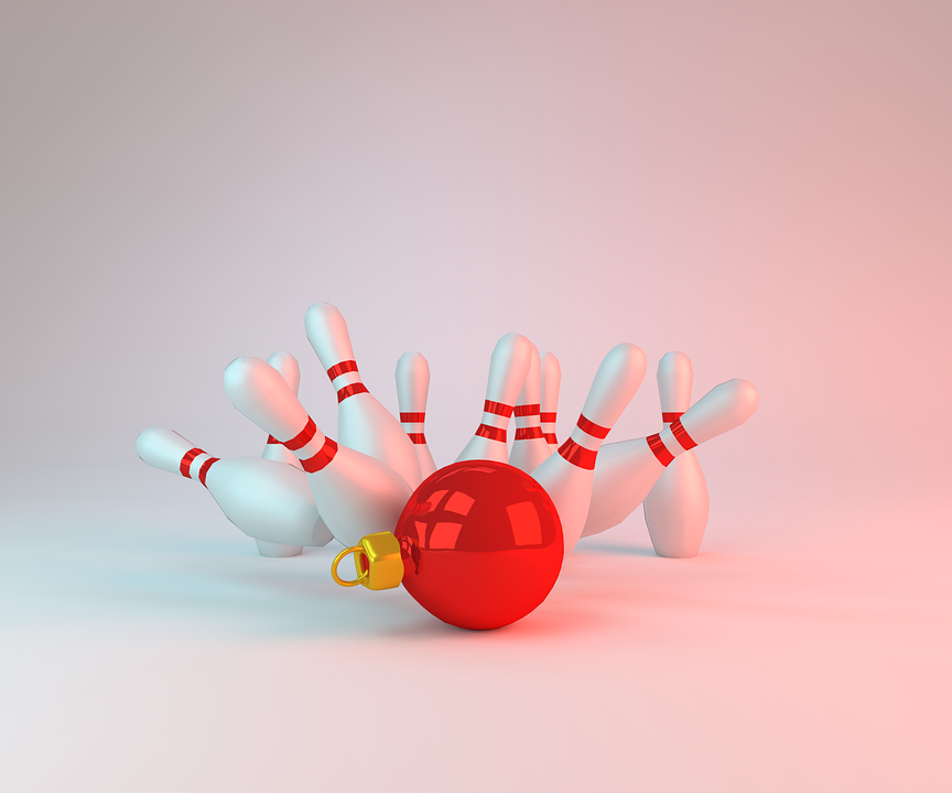 Computer generated image of bowling pins being knocked down by a Christmas ornament