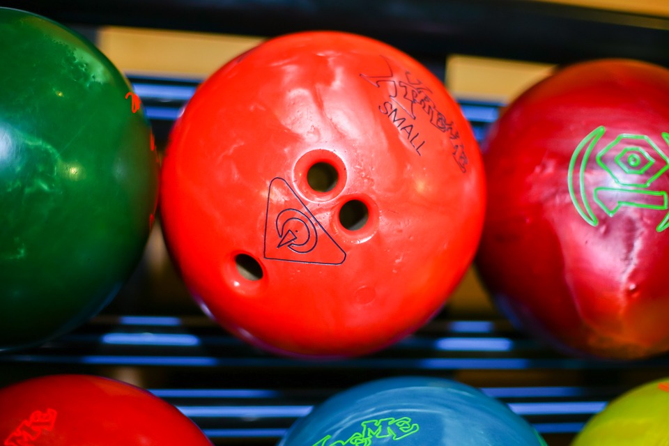 Colorful bowling balls on ball return