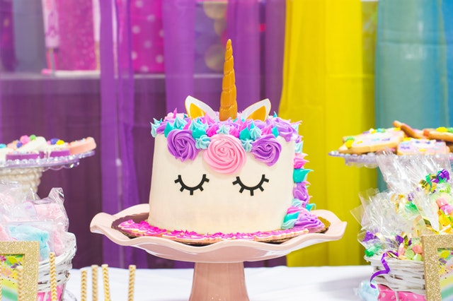 Unicorn birthday cake with colorful decorations
